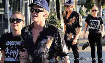 Miley Cyrus walks arm-in-arm with Australian beau Cody Simpson during West Hollywood shopping trip