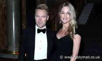 Storm Keating reveals her growing baby bump in LBD as she joins husband Ronan at awards ceremony 