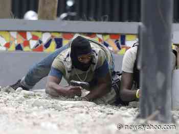 Take a look at photos of Haiti's capital where the police and army clashed, killing a soldier and canceling the Carnival celebrations