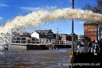 Flood clear-up work begins in York, but defences remain in place