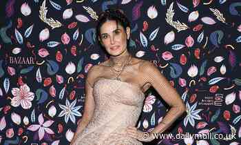 Demi Moore, 57, dazzles in metallic princess-style ballgown as she makes regal arrival to PFW event