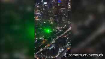 Video shows green laser strike air ambulance in downtown Toronto