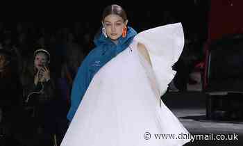 Gigi Hadid storms the catwalk in a MASSIVE white tulle wedding gown-raincoat HYBRID