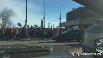 Protesters march in downtown Edmonton in support of public sector workers