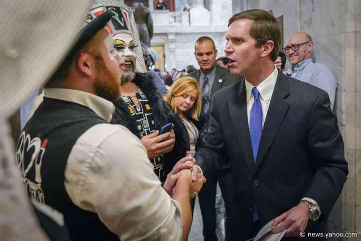 Kentucky governor defends photo posing with drag queens