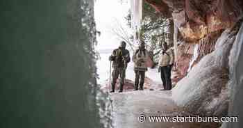 Ice cave formations draw curious to Lake Superior's south shore: 'It's so quiet out here'