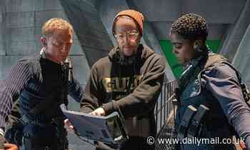 Daniel Craig and Lashana Lynch watch a scene with director Cary Fukunaga in No Time To Die snap