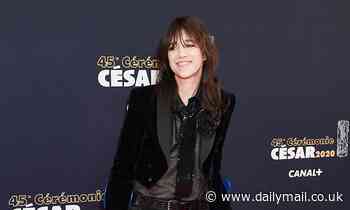 Charlotte Gainsbourg sports a leg cast and crutches on the red carpet at 45th César Awards
