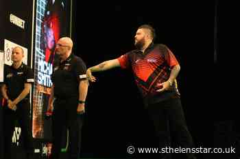 Family lead the celebrations after Michael Smith's nine-darter - St Helens Star