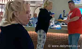 Mama June Shannon and boyfriend Geno Doak share a plate of fries at a Florida food court