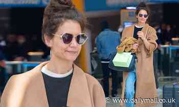 Katie Holmes shows off her casual eye for style as she returns home from Paris Fashion Week 
