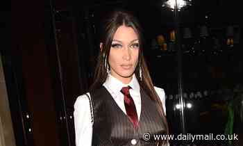 Bella Hadid nails androgynous chic in chocolate satin waistcoat and silk tie