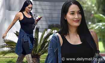 Nikki Bella is one stylish mom-to-be as she shows off a hint of baby bump