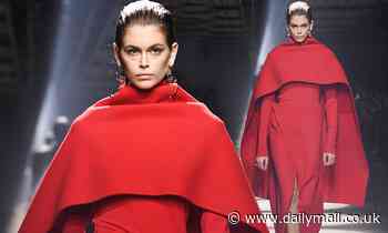 Kaia Gerber commands attention in a billowing scarlet caped gown at Givenchy's PFW show