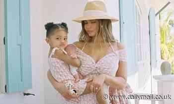 Kylie Jenner and daughter Stormi wear similar pink-and-white dresses from Dior