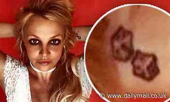 Britney Spears regrets her tattoo and tells fans she is thinking of removing the 'pink dice'