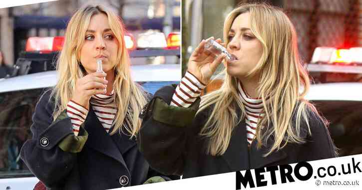 Kaley Cuoco sips miniature bottle of vodka in the middle of a crime scene on set of The Flight Attendant