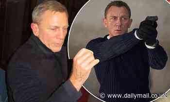 Daniel Craig signs autographs for fans after release of his new James Bond film is pushed back