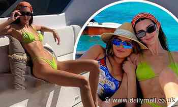 Kendall Jenner shows off her catwalk physique in neon bikini