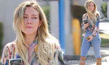 Hilary Duff flaunts trim waist in light-wash jeans, while stepping out in sleek knee-high in LA