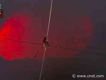 Daredevil Nik Wallenda tightrope walks his way across active volcano     - CNET