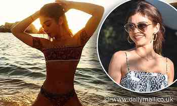 Sarah Hyland posts a snap for Thirsty Thursday showing the starlet in a skimpy bikini in the sand