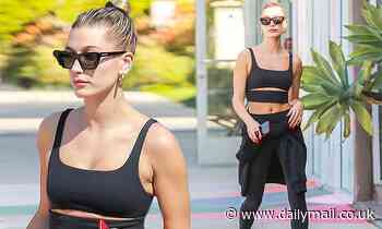 Hailey Bieber flaunts her toned abs in sporty black top