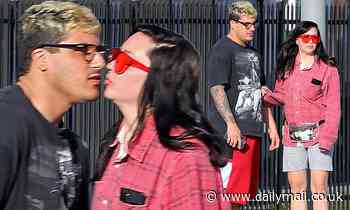 Amanda Bynes leans in to give her fiance Paul Michael a smooch out on a casual lunch date