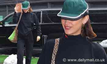 Bella Hadid shades face with baseball cap as she steps out in the NYC showers