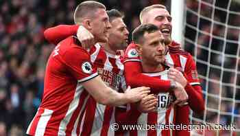 Billy Sharp’s strike and Dean Henderson’s heroics maintain Blades’ European push