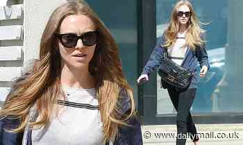 Amanda Seyfried cuts a casual figure in a navy blue zip-up hoodie for a morning coffee run