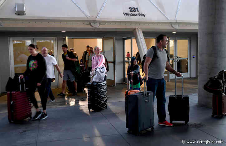 Finally! Cruise passengers eagerly disembark the Carnival Panorama in Long Beach