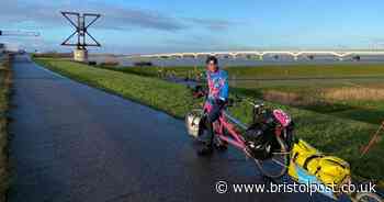 A Bristol man with stage four cancer has made it to France on epic cycle to China