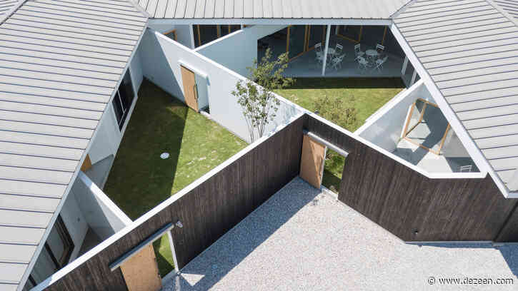 Tato Architects uses old barrels to clad exterior of home and shop