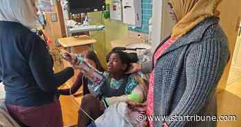 Boy hit by pickup while boarding school bus in St. Paul begins rehab