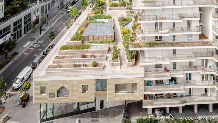Irregular balconies surround social housing stacked over school in Paris