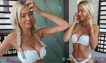 Olivia Attwood flaunts her incredible figure in a plunging white bikini