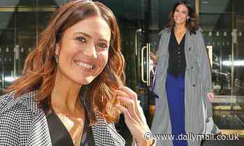 Mandy Moore looks radiant in a trendy trench coat after performing on the Today show in NYC