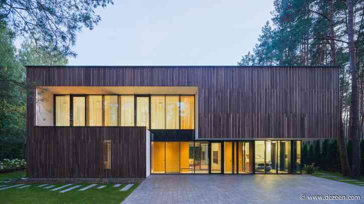 Smilgu House in Lithuania has a glass garage to display its owner's car