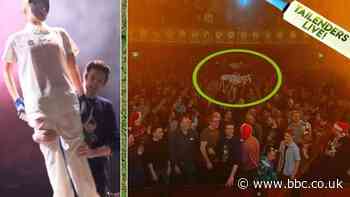 Greg James crowd surfs a mannequin dressed up as Allan Lamb.