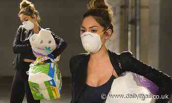 Farrah Abraham dons a face mask and rubber gloves as she stocks up on toilet paper and disinfectant