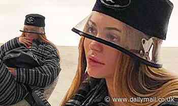 Kylie Jenner suits up in stripes and a Prada bucket hat for a stop at Kylie Cosmetics headquarters