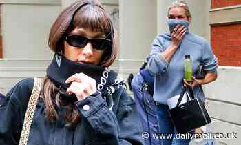 Bella Hadid and mom Yolanda protectively cover their mouths amid the coronavirus outbreak in NYC