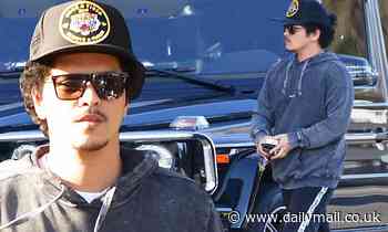 Bruno Mars looks low-key as he shops for a Vespa scooter with girlfriend Jessica Caban