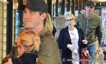 Emma Roberts and her boyfriend Garrett Hedlund tenderly embrace on grocery run in Los Angeles