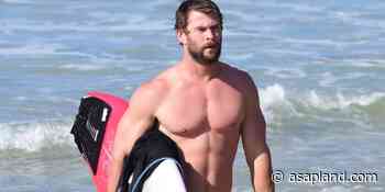 Chris Hemsworth butt on the beach doing yoga and surfing - Asap Land