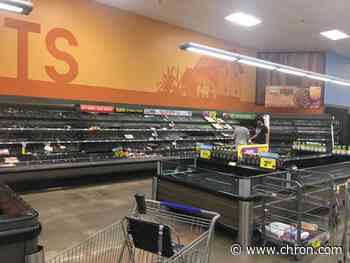 Haunting Houston photos show long lines, empty shelves despite pleas to avoid hoarding - Chron.com