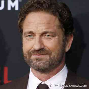 Gerard Butler takes part in Olympic torch relay in Greece