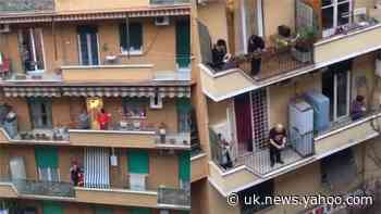 ‘My street came alive’: Rome sings anthem from balconies during lockdown