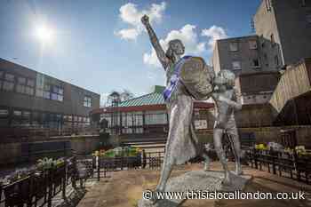 Statues get purple sashes for International Women's Day